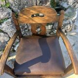 Pair of armchairs in stained wood and leather, 20th century