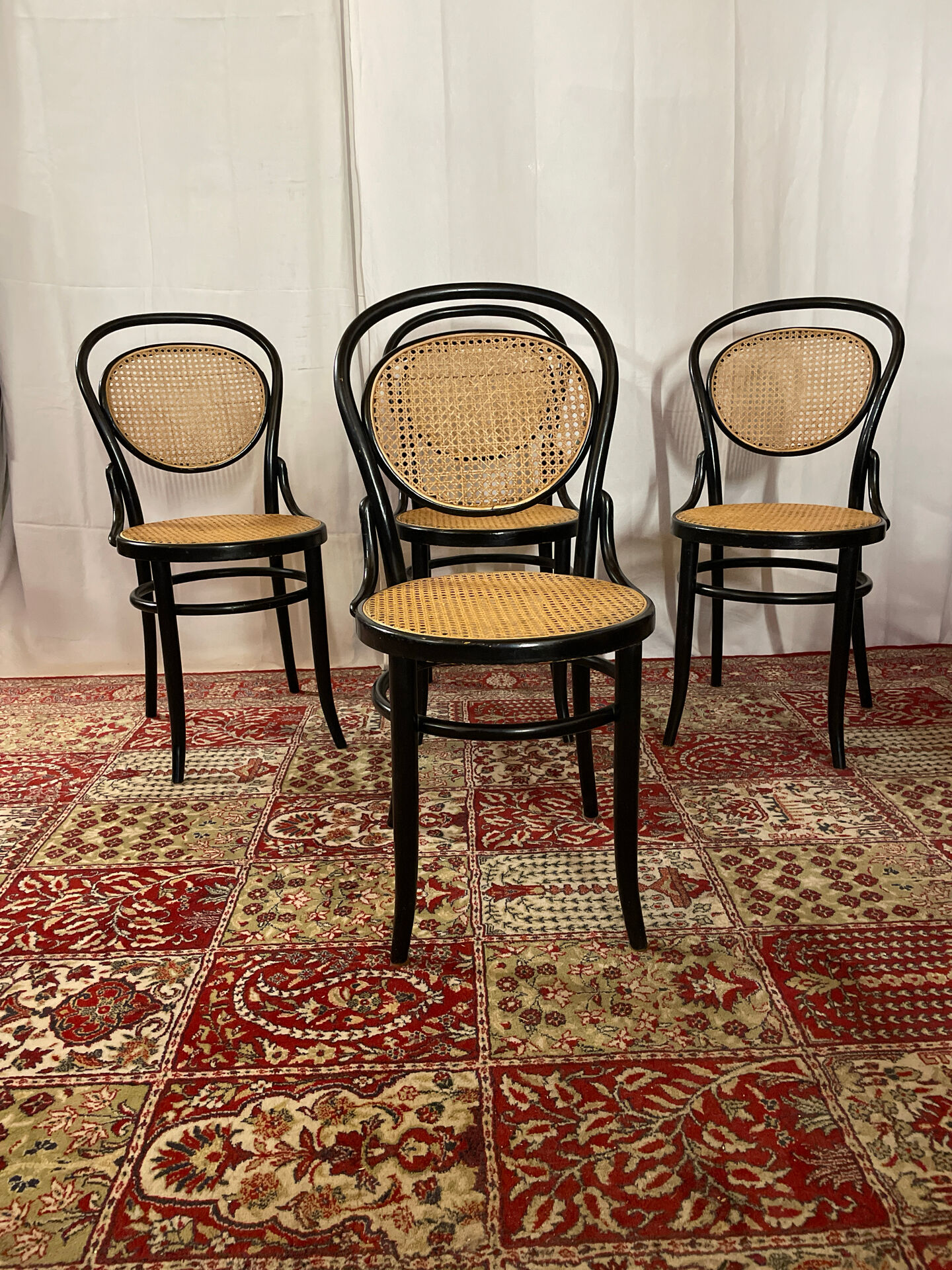Set of 4 bentwood bistro chairs in black with caning.