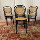 Set of 4 bentwood bistro chairs in black with caning.