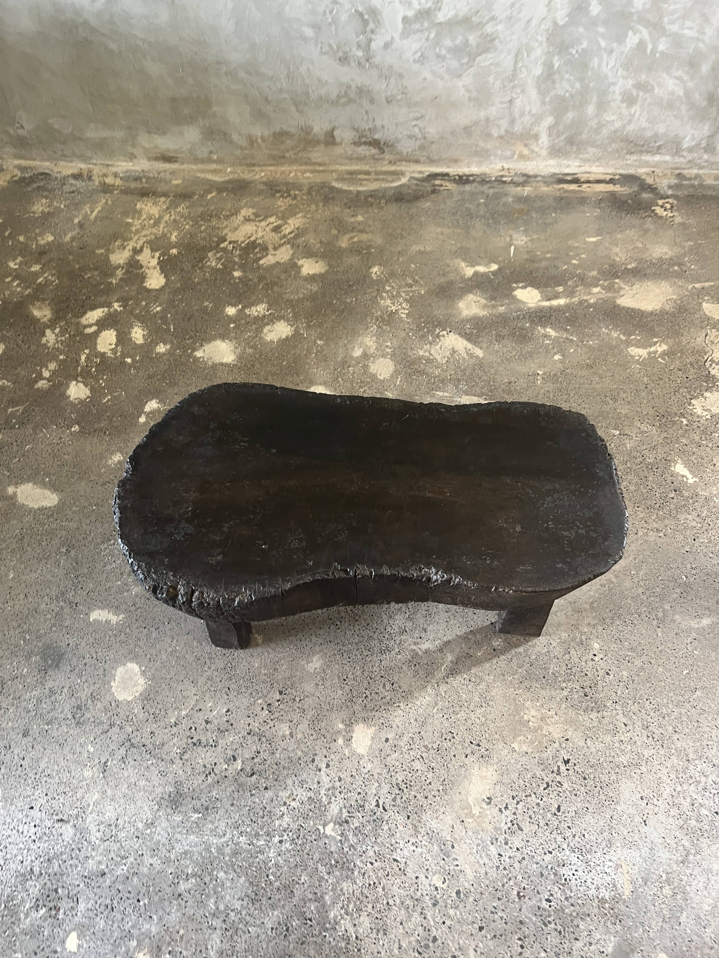 Small old Asian wooden coffee table in Japanese style, kidney-shaped top
