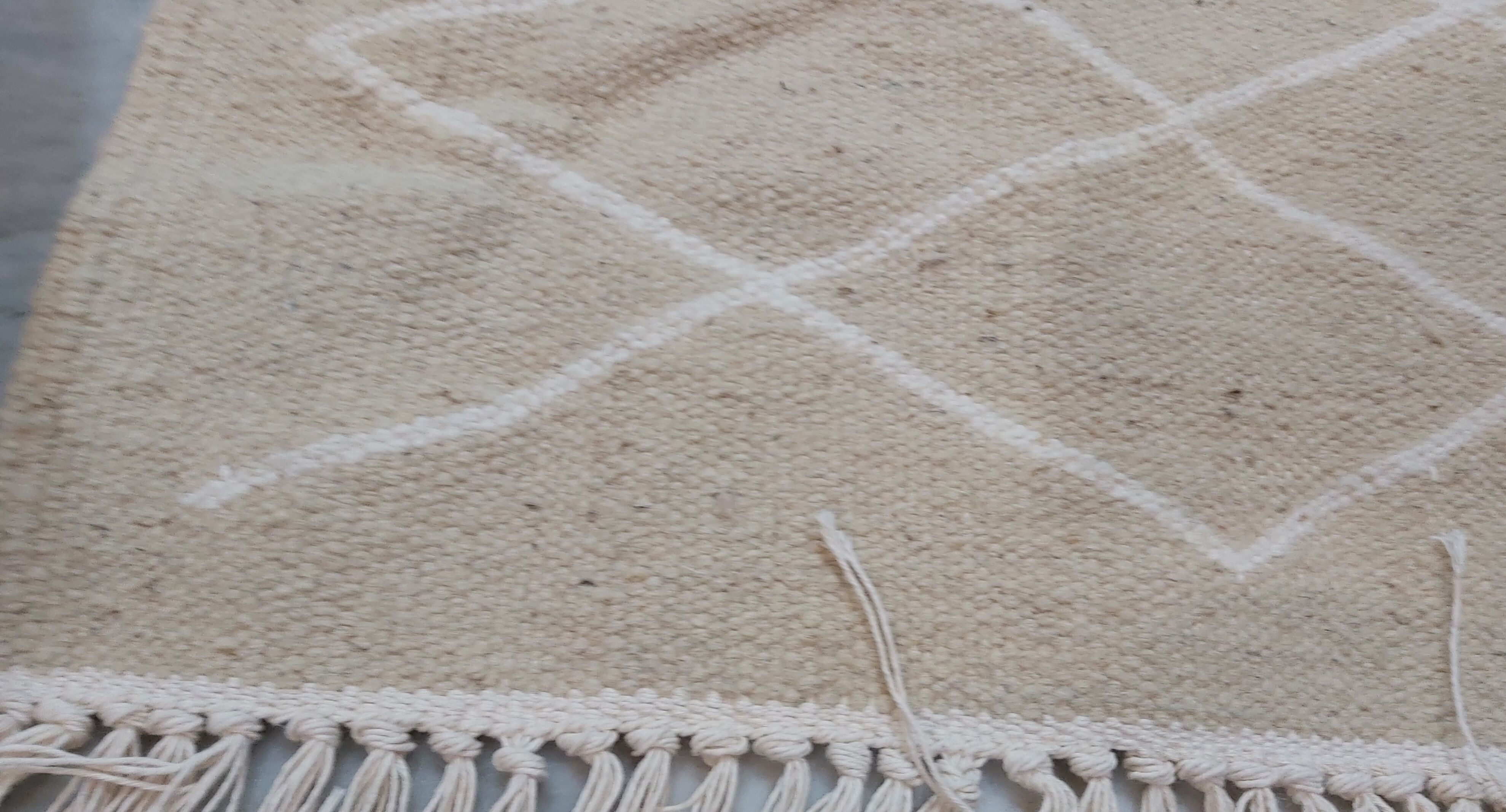 Hand-made beige and white wool rug 65x144cm