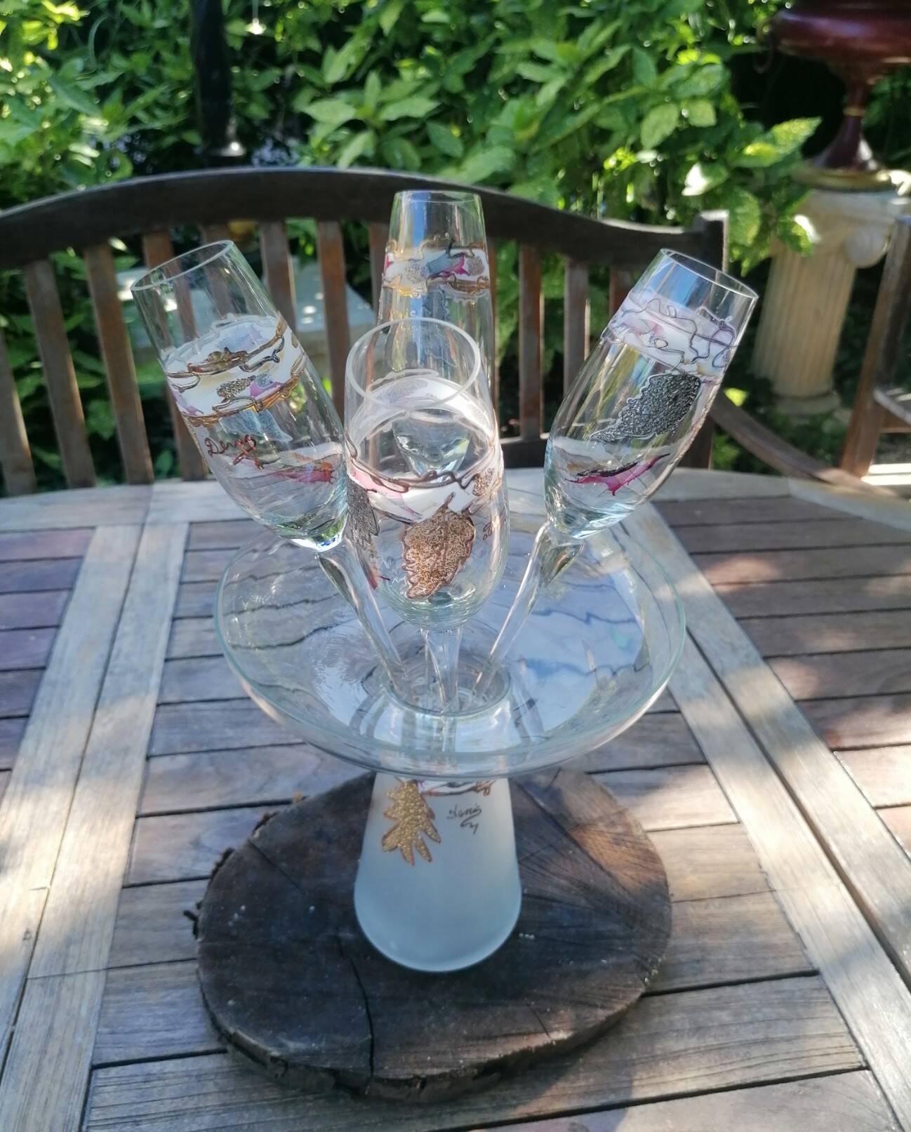 Set of 4 painted blown glass champagne flutes. Signed Denis.