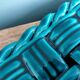 Emerald green braided slip trivet and bottle holder, knife holder