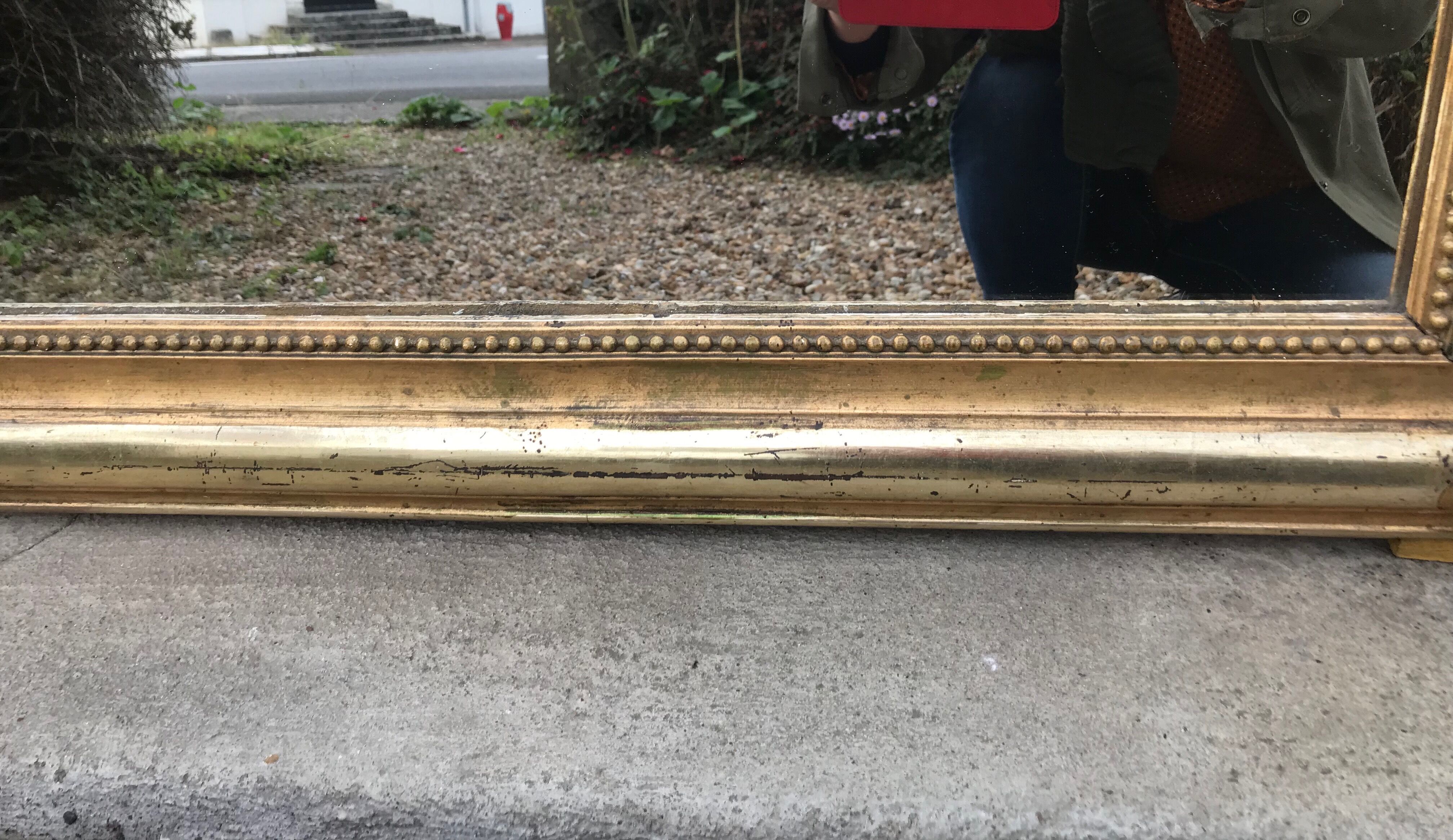 Mirror with a golden leaf pediment, 151x90cm