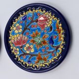 A flat bottom and two enamel bottle bottoms of Longwy