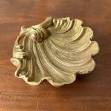 Bronze “shell” pocket emptier