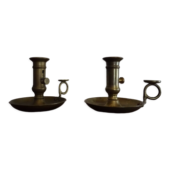 Pair of vintage brass pusher candle holders