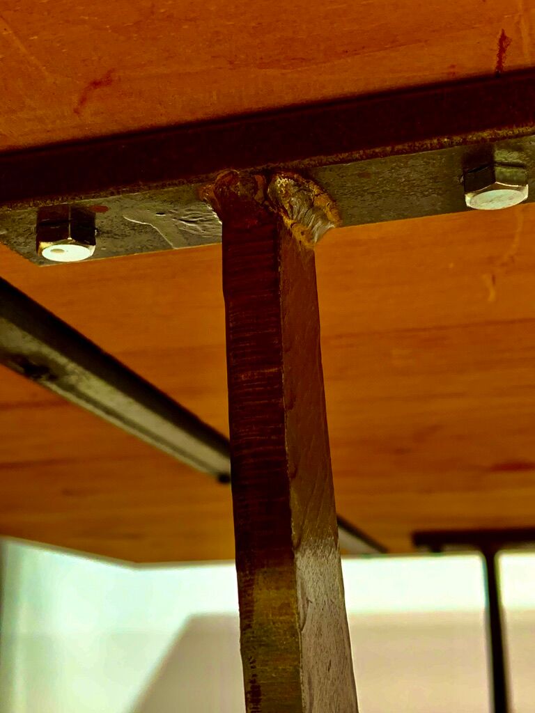 Rectangular wooden table, legs and spacer in hammered ironwork, 60s