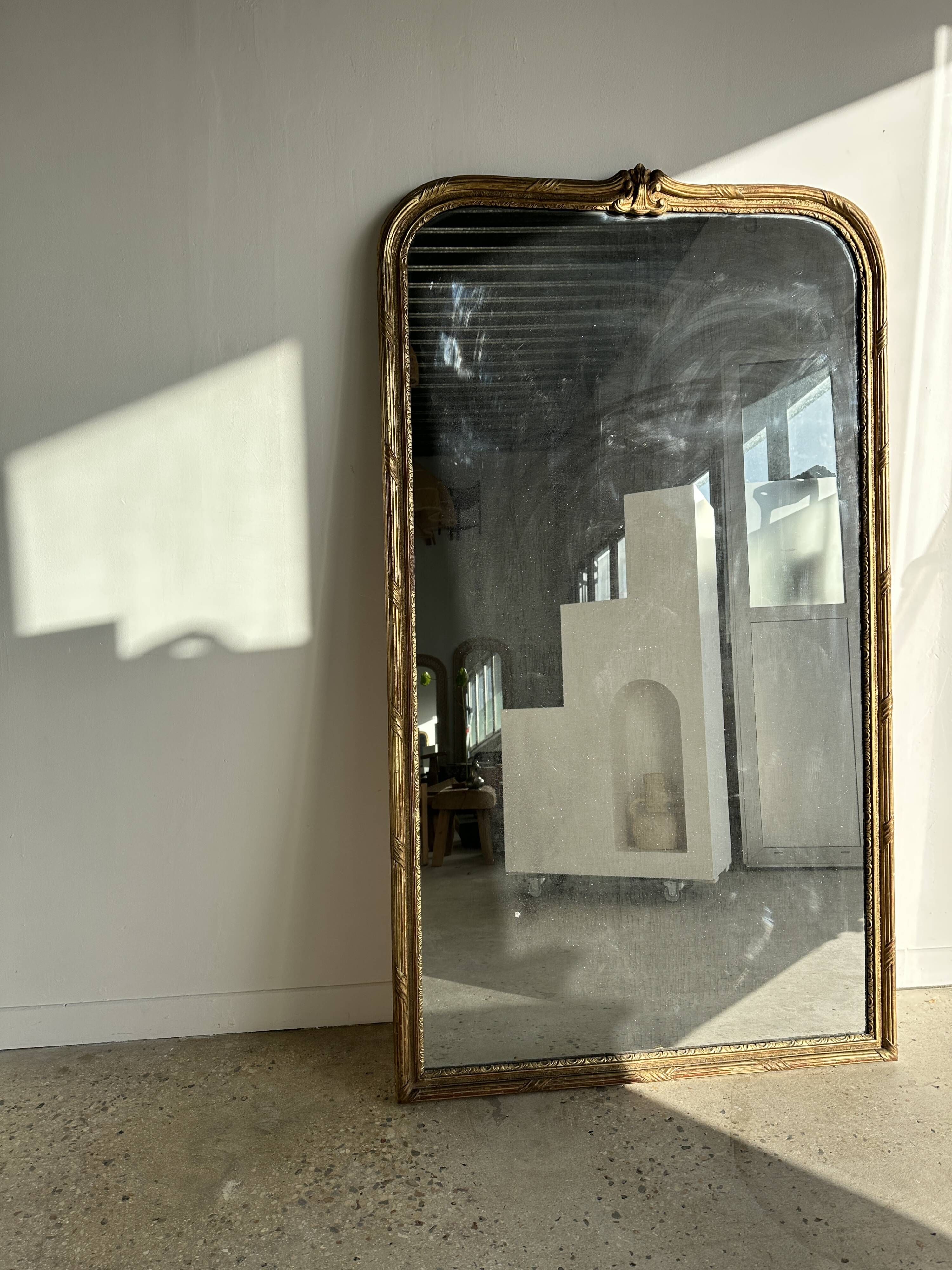 Large gilded mirror 19th century rounded corners mercury glass Louis XVI style