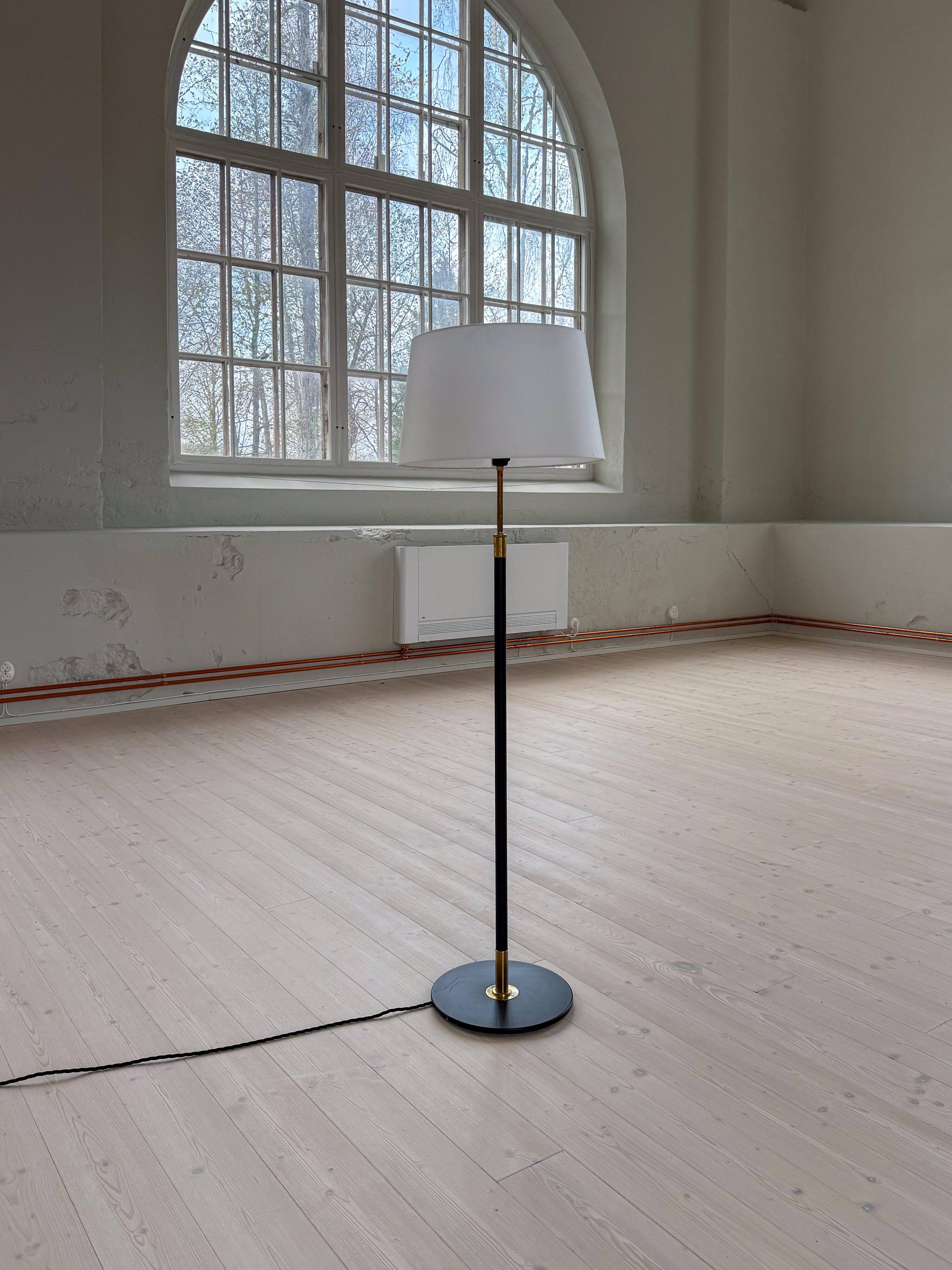 Modern mid-century floor lamp by Aage Petersen, for Le Klint, Denmark, 1970s.