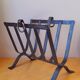 Brutalist magazine rack in forged steel, 1950.