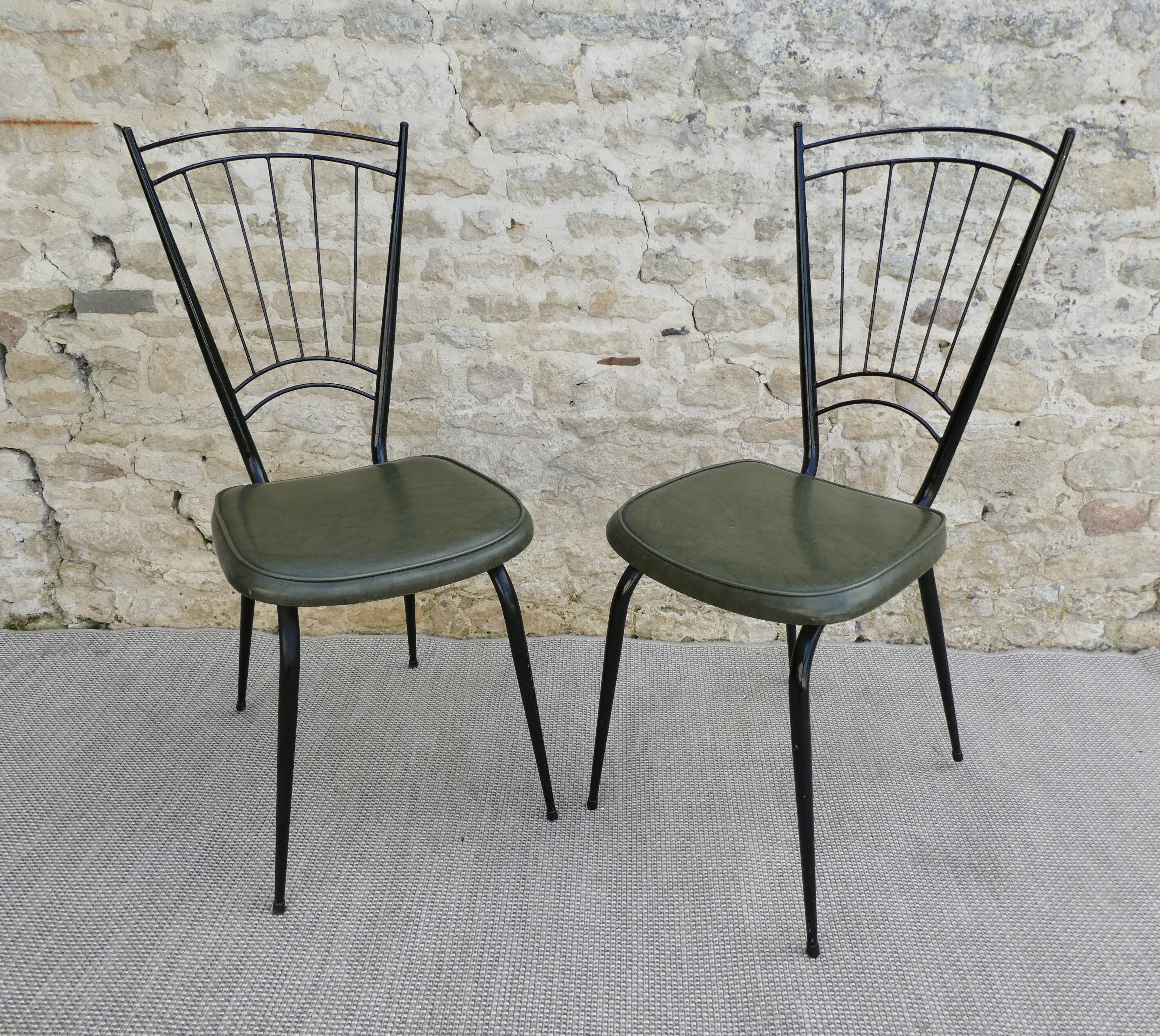Pair of black metal chairs and khaki green skai, 60s