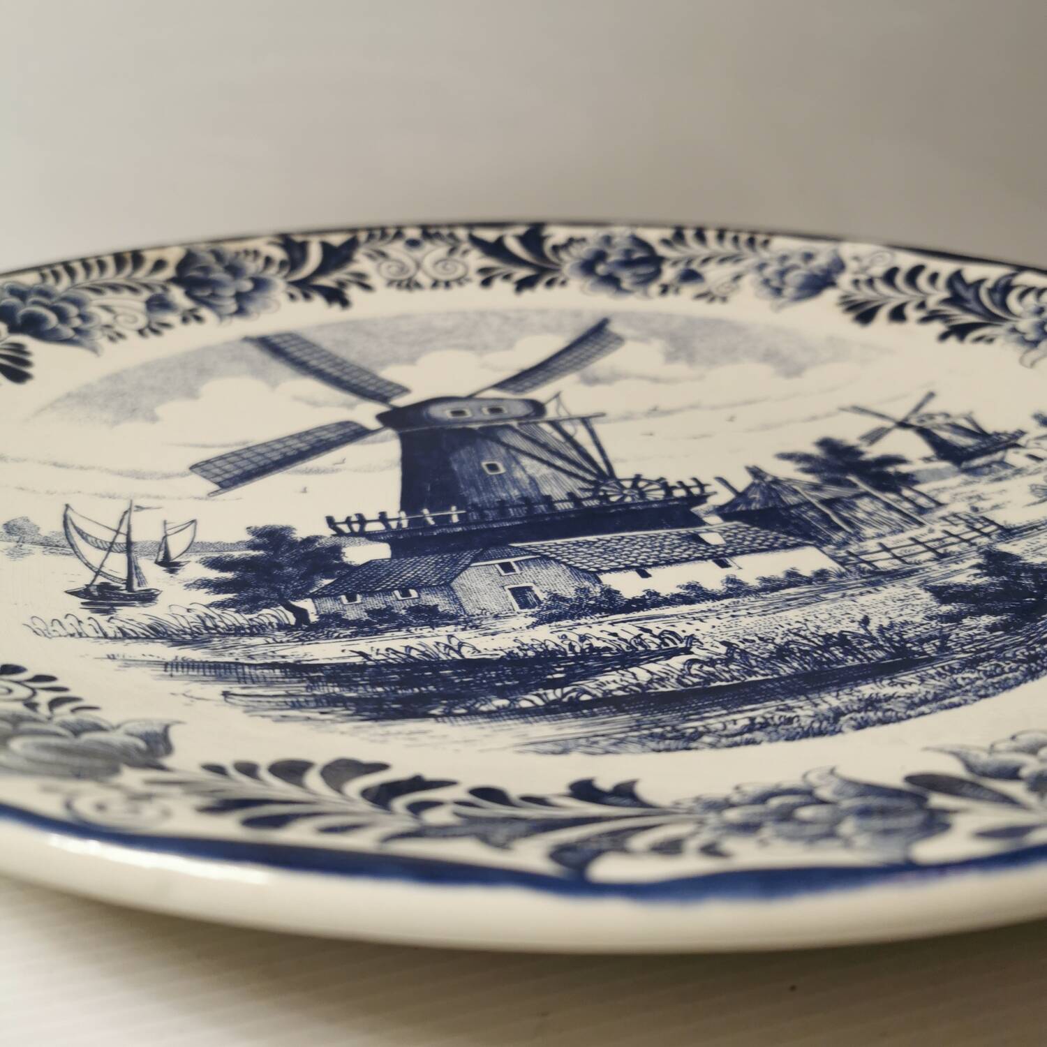 Delft earthenware dish decorated with a mill late 19th early 20th century diameter 39 cm