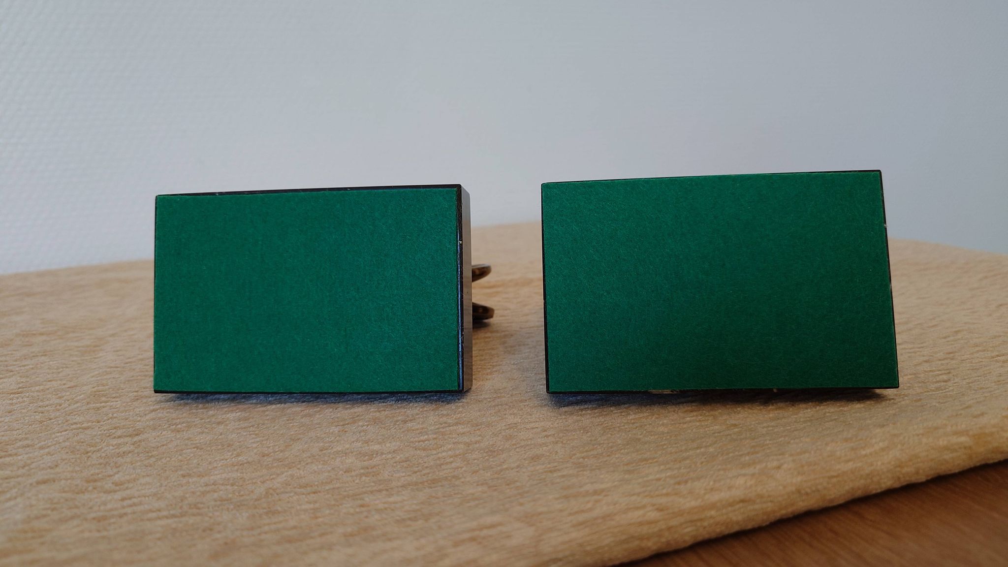 Art Deco pair of bookends with ram's heads, patinated metal and black marble.