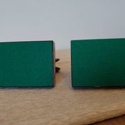 Art Deco pair of bookends with ram's heads, patinated metal and black marble.