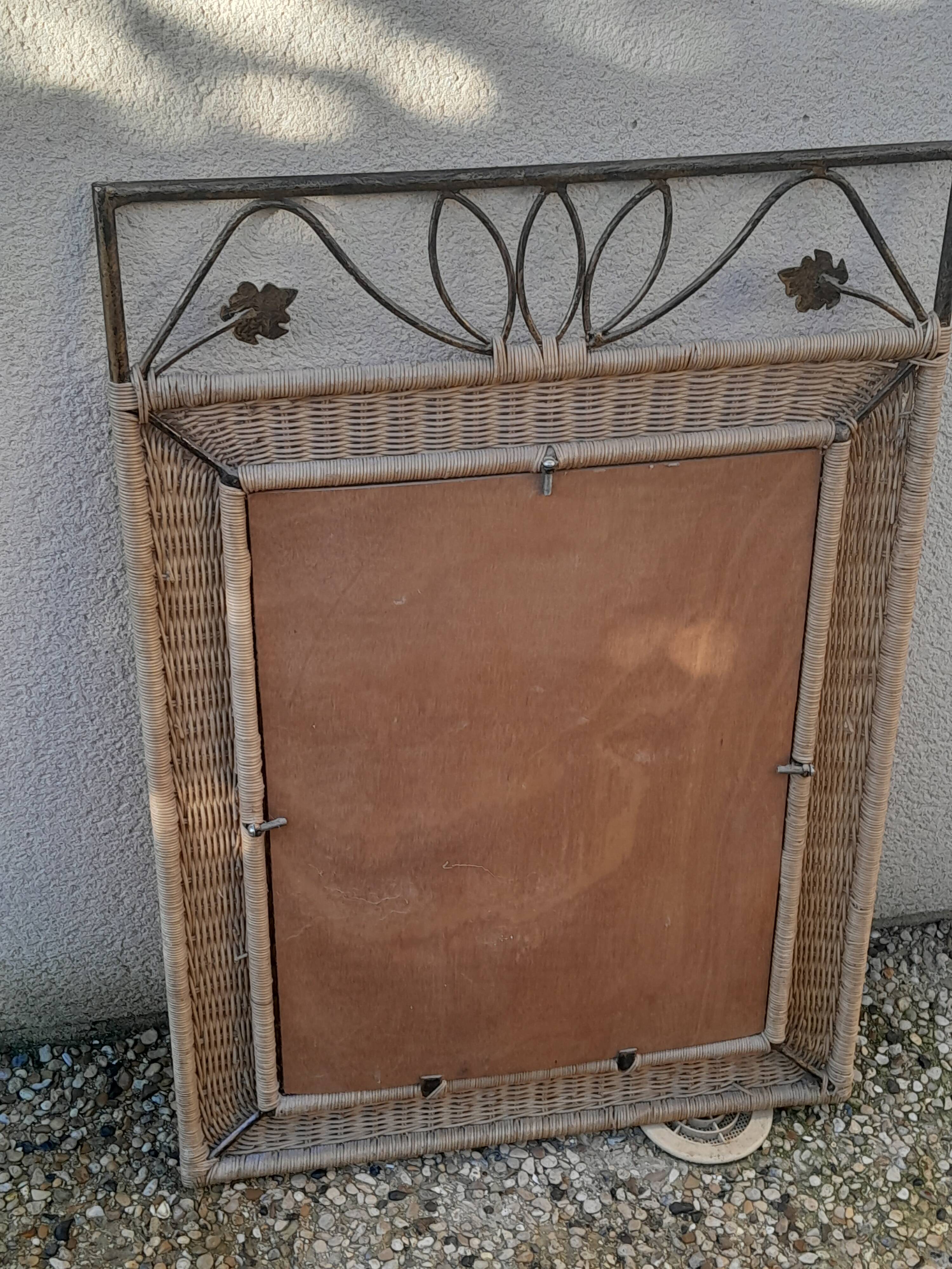 Vintage rattan and wrought iron mirror