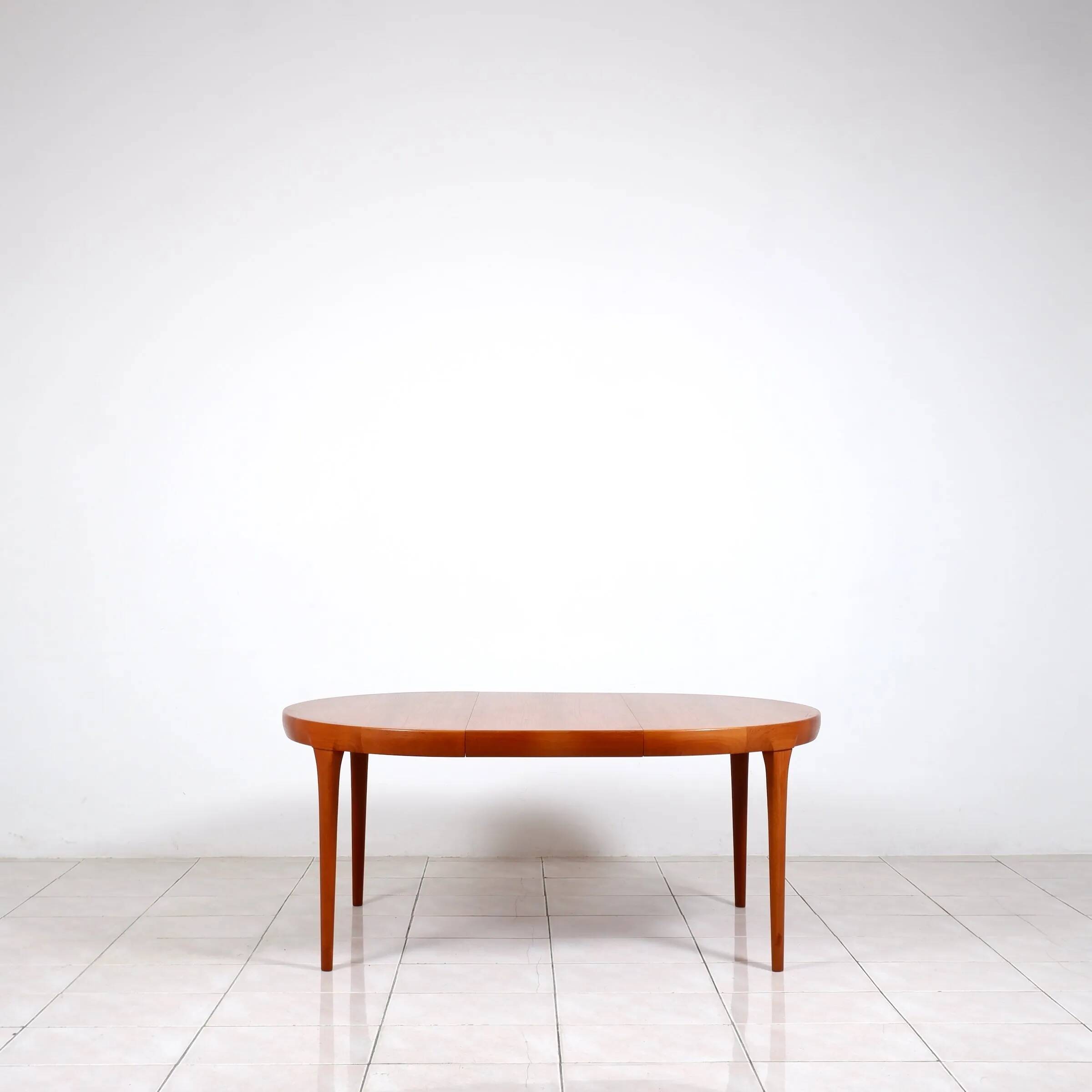 Round dining table in teak by Ib Kofod Larsen for Faarup Mobelfabrik