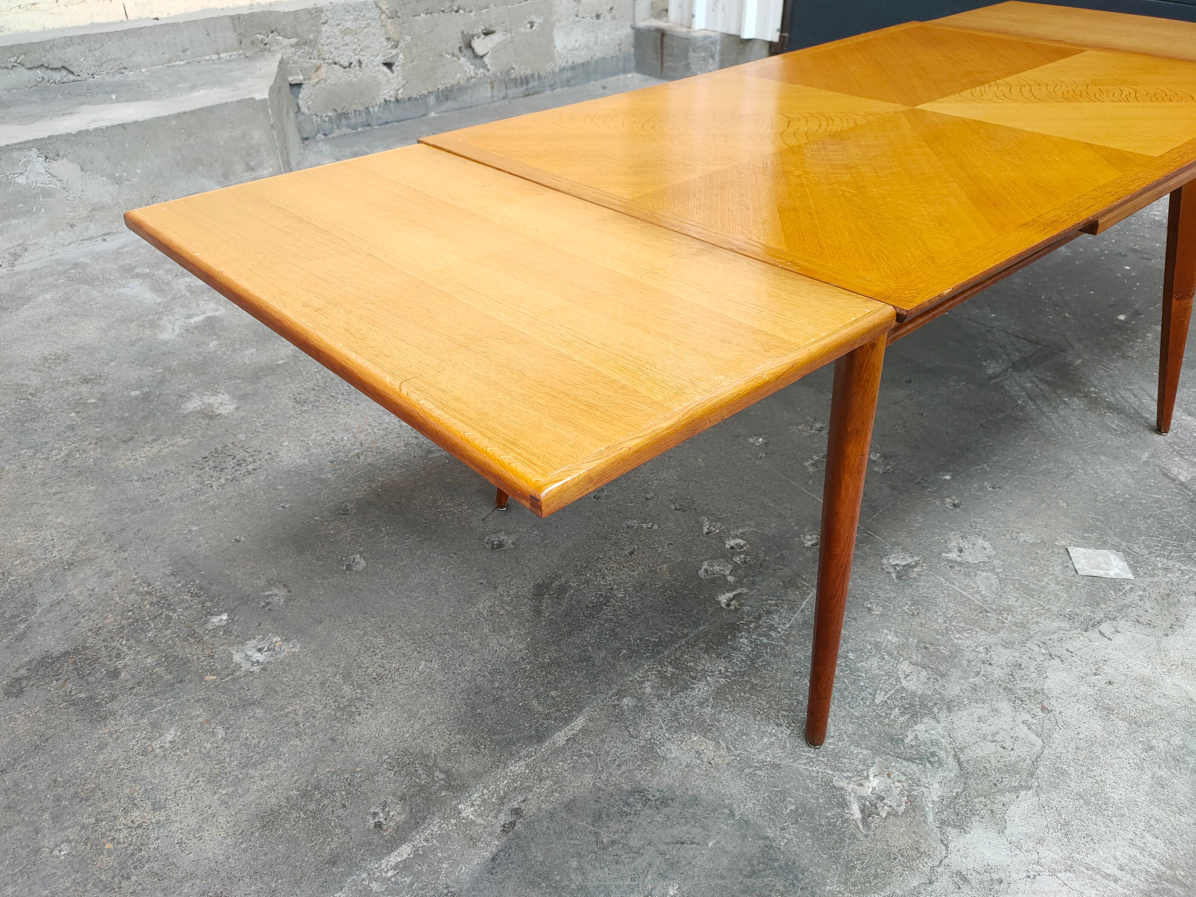 Dining table with oak compass legs