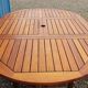 Stretchable garden dining table in solid teak