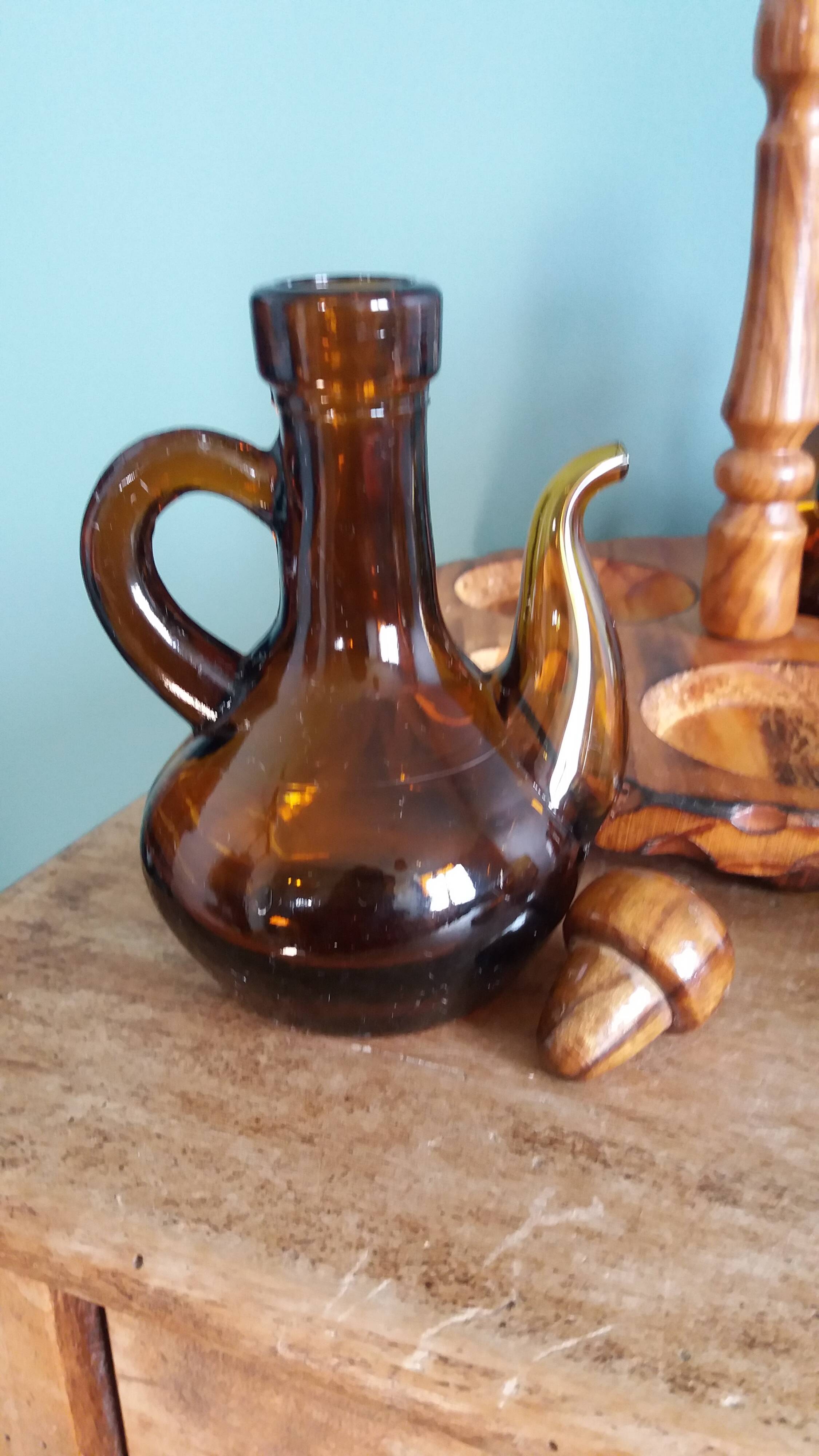Oil, vinegar, mustard, pepper, salt, olive wood servant from Spain.
