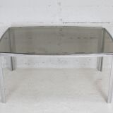 Living table. chrome metal, curved smoked glass slab, france, circa 1970.