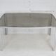 Living table. chrome metal, curved smoked glass slab, france, circa 1970.