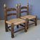 Ensemble de 2 chaises basses avec assise en paille, années 1950.