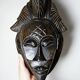 Decorative African wall mask in Punu Tsangui style, carved wood, 20th century.