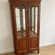 Antique cherry wood display cabinet in Louis XV style
