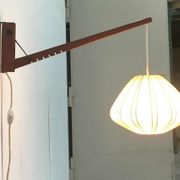 Mid-century pivoting wall lamp with a swing arm, Cocoon, made of teak wood, 1960s.
