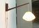 Mid-century pivoting wall lamp with a swing arm, Cocoon, made of teak wood, 1960s.