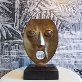 brutalist bronze face sculpture