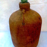 Demijohn dressed in burlap and padded cork