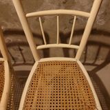 2 white wooden chairs