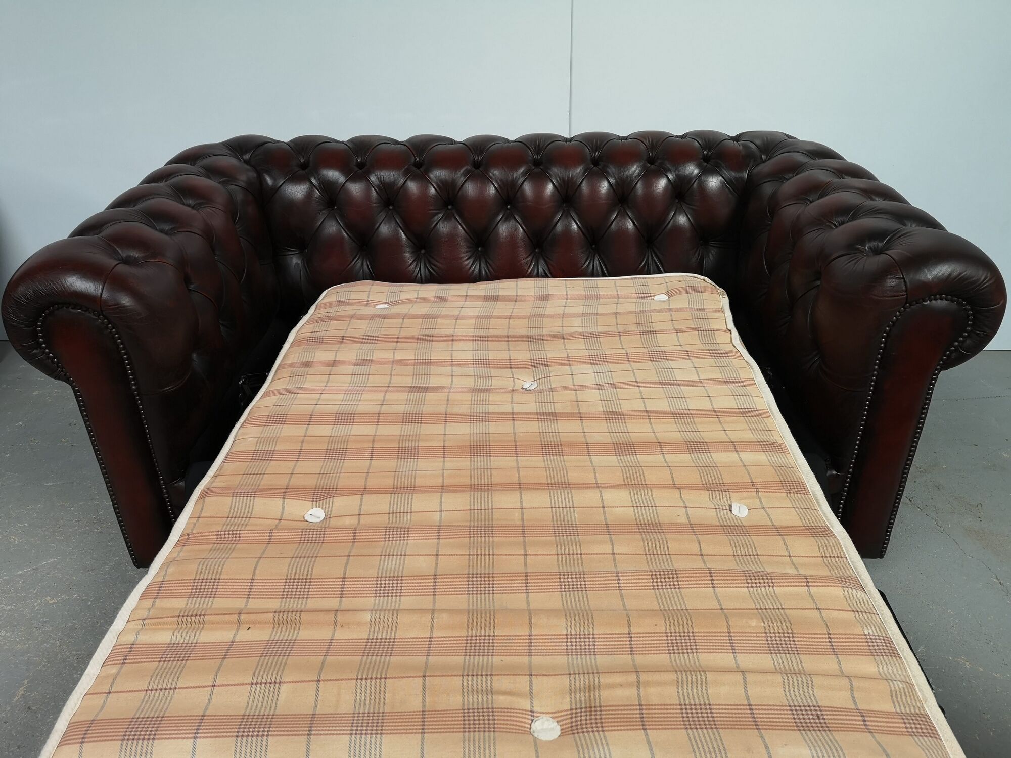 Convertible leather chesterfield sofa