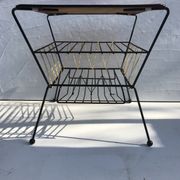 Old coffee table with black metal and scoubidou magazines holder