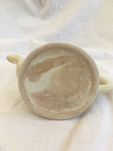 "Selfish" cream-colored teapot