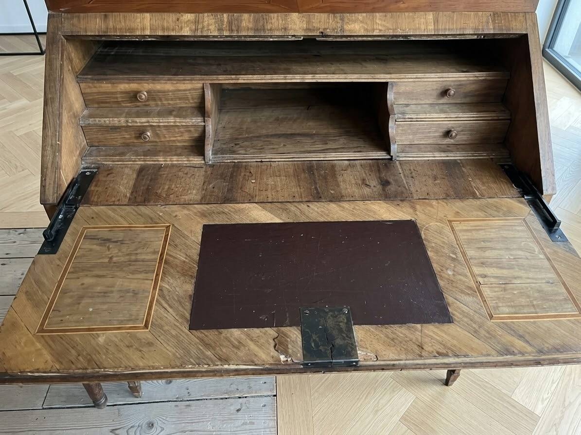 Antique wooden secretary desk with marquetry.