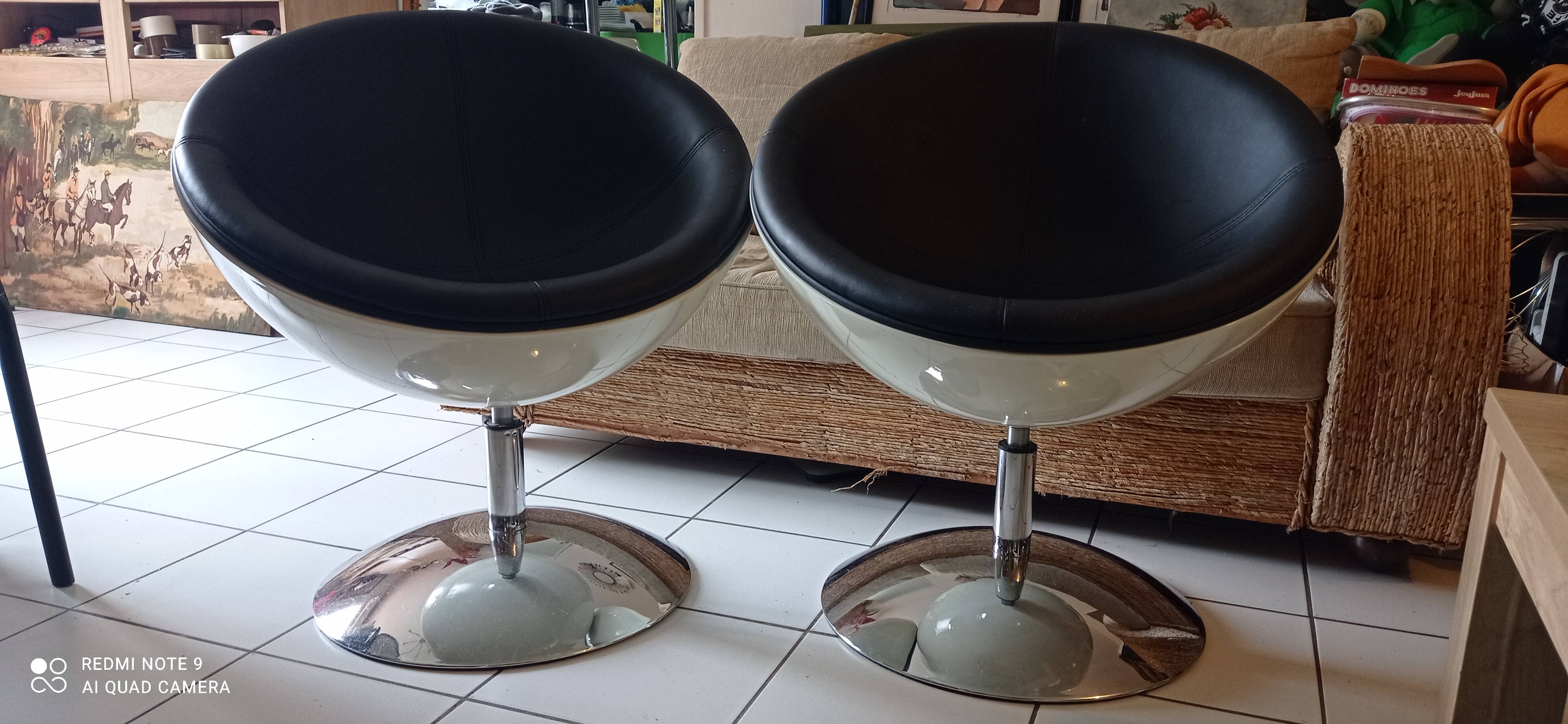 Pair of vintage white ball and black imitation leather swivel armchairs