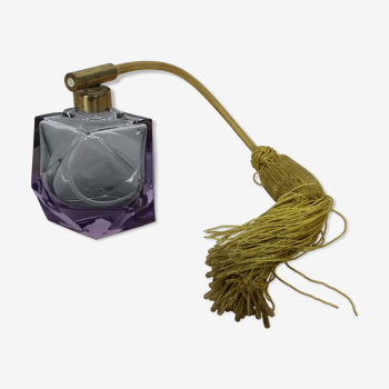 Old perfume bottle in purple glass