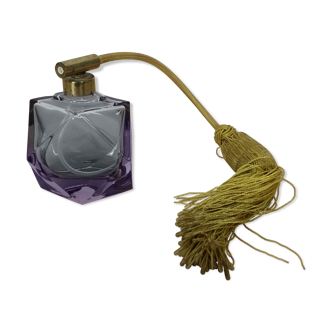 Old perfume bottle in purple glass