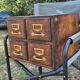 Workshop furniture made of oak and brass.