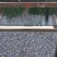 Golden and iridescent metal desk with a glass top from the 70s/80s.