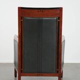 Black cowhide leather and wooden Art Deco design armchair