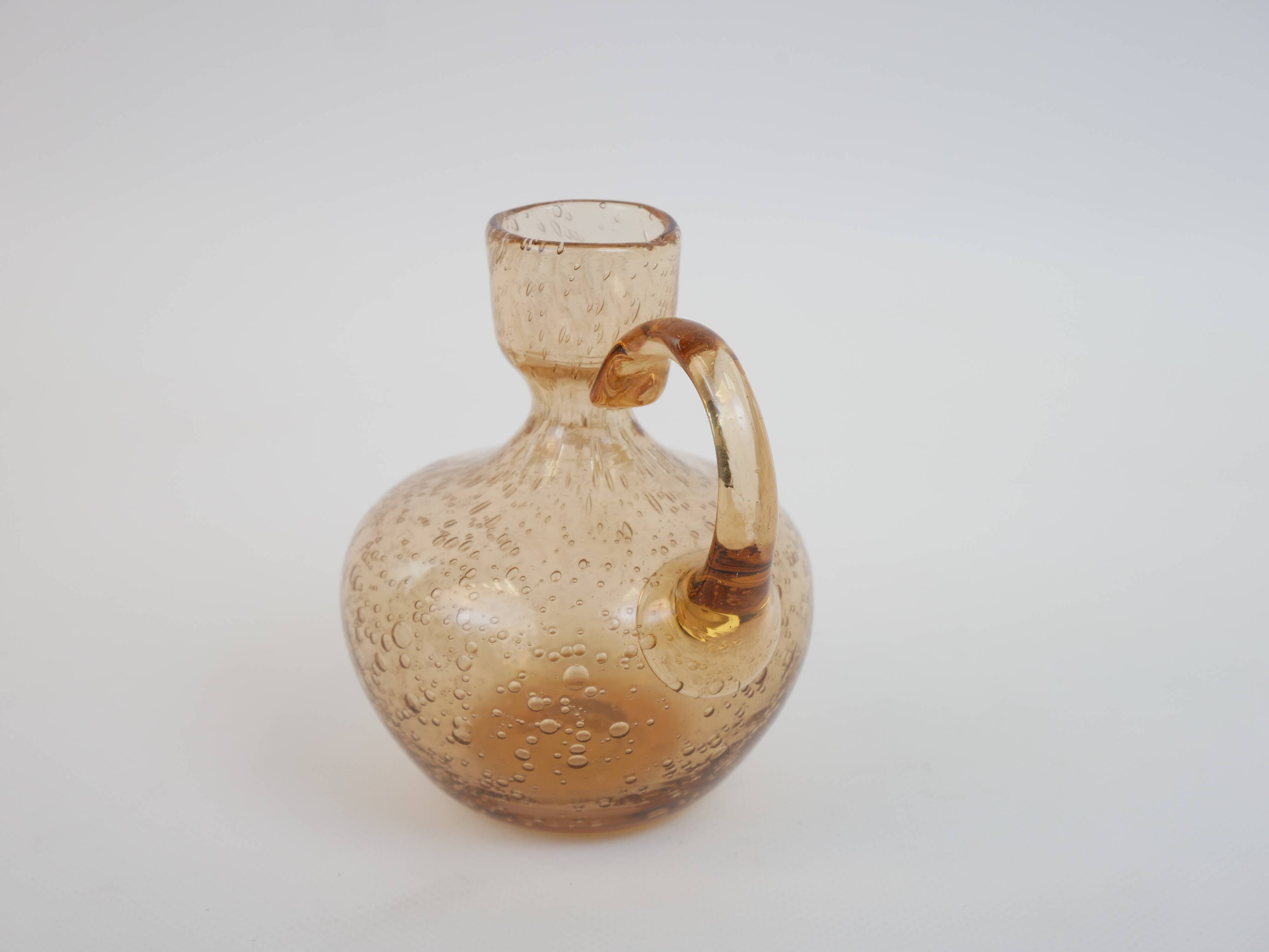 Petit porte bougie en verre bullé rose de Biot