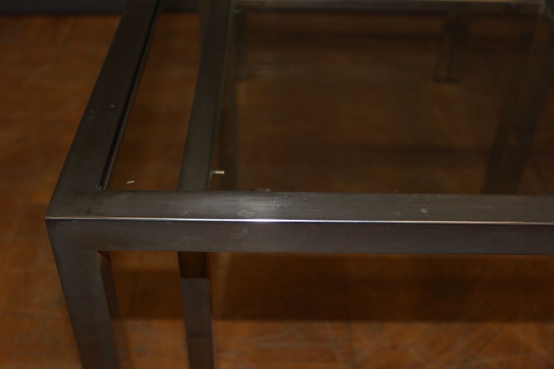 Coffee table and its steel and glass wiggles around 1970