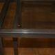 Coffee table and its steel and glass wiggles around 1970