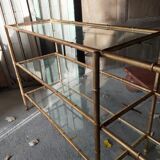 Console in gilded metal and glass