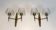 Pair of bronze wall sconces with worked glass reflectors. Stilnovo
