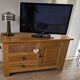 Buffet / TV unit in solid oak with a caned door.